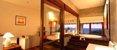 Deluxe Ocean View | Minibar, in-room safe, individually decorated, desk