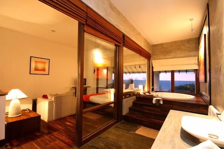 Deluxe Ocean View | Minibar, in-room safe, individually decorated, desk. Temple Tree Resort & Spa