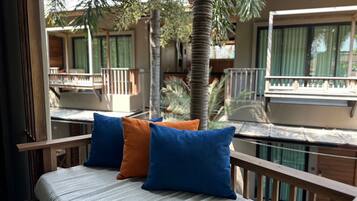 Deluxe Room, Corner | Living area | 54-inch LED TV with digital channels