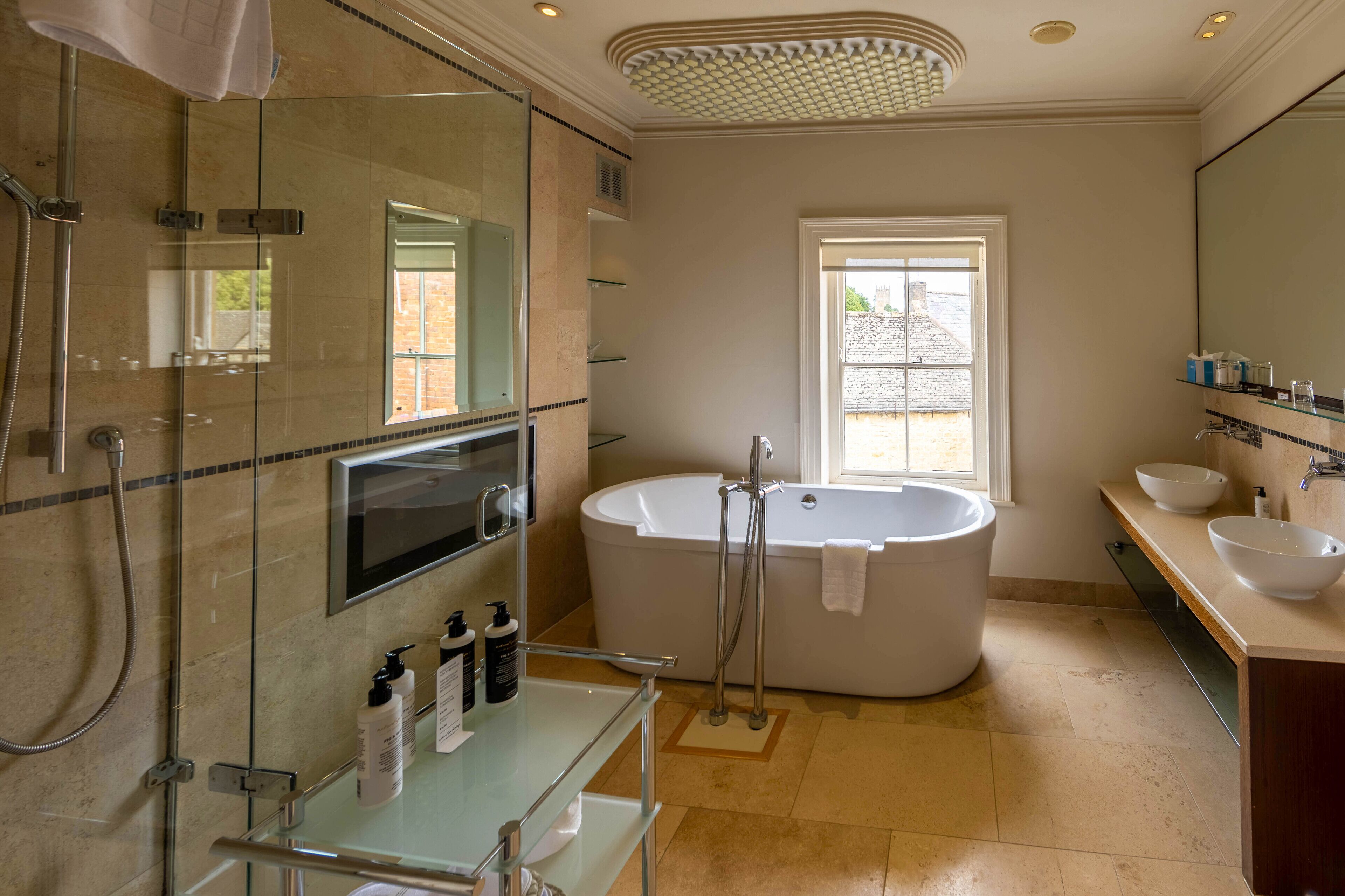junior suite | bathroom | combined shower/bathtub, free toiletries, hair dryer, bathrobes