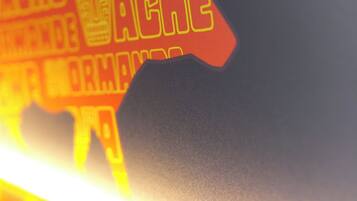 A close-up of a wall with a silhouette of a horse and the word "VACHE" in bold letters.
