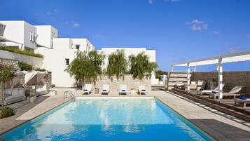 Seasonal outdoor pool, open 11:00 AM to 9:00 PM, pool umbrellas