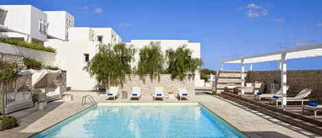 Seasonal outdoor pool, open 11:00 AM to 9:00 PM, pool umbrellas