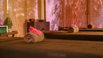 Experience ultimate relaxation in this serene spa setting, featuring a massage table and soothing ambiance.