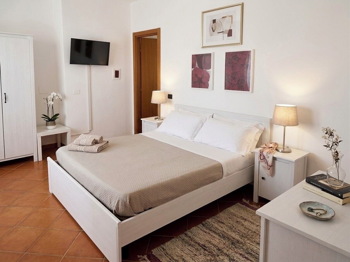 Quarto família, 2 quartos | Frigobar, berços (sobretaxa), roupa de cama
