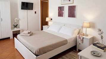 Quarto família, 2 quartos | Frigobar, berços (sobretaxa), roupa de cama