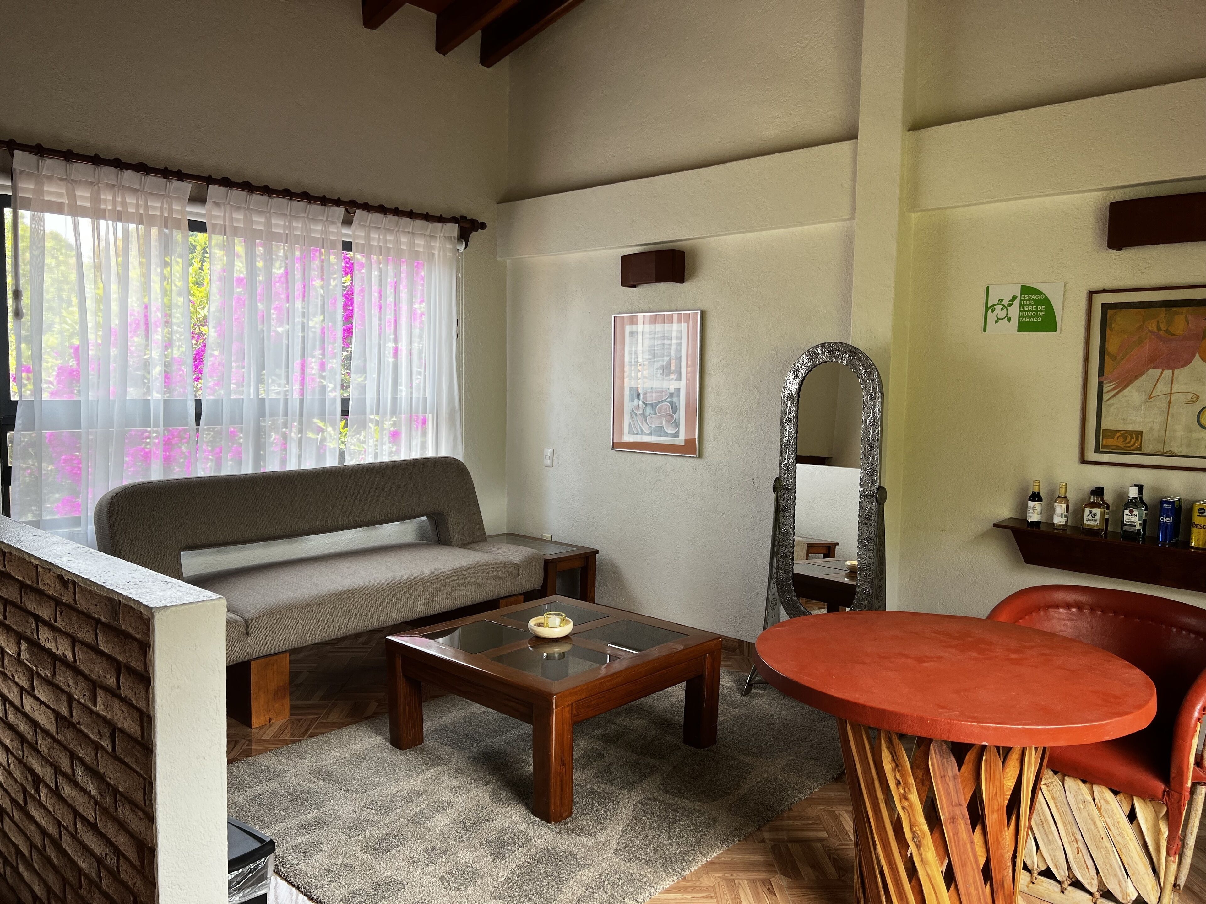 signature suite | living area | 32-inch flat-screen tv with cable channels, tv