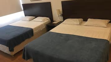 Quadruple Room, Multiple Beds | Minibar, desk, free WiFi, bed sheets