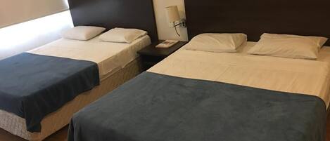 Quadruple Room, Multiple Beds | Minibar, desk, free WiFi, bed sheets