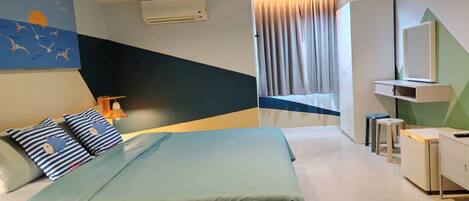 A modern bedroom with a bed, bedside tables, a nightstand, a wall-mounted air conditioner, and a window with curtains.