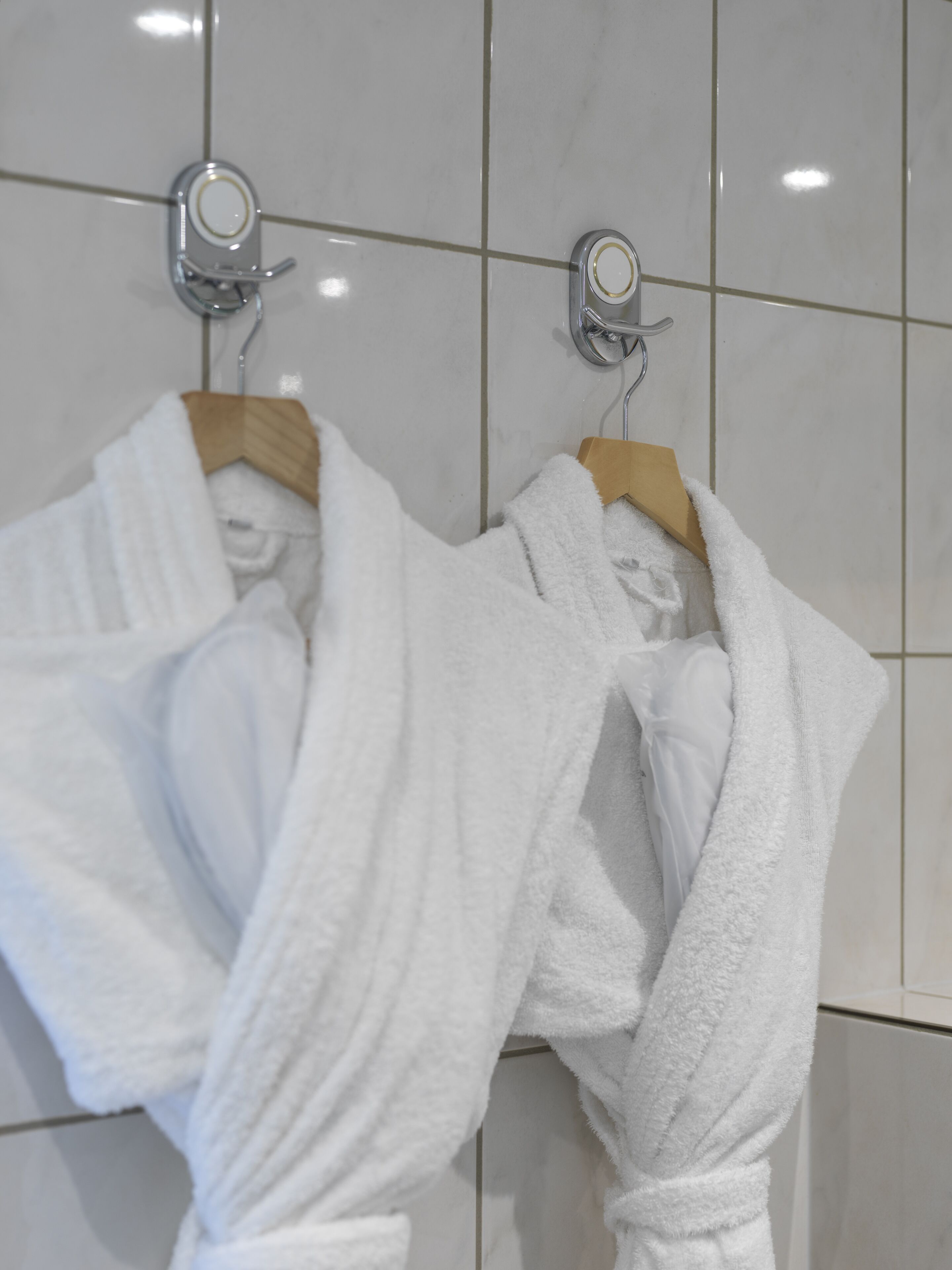 shower, designer toiletries, hair dryer, towels