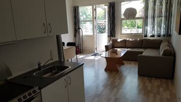 Apartment, 1 Bedroom, Kitchen, Pool View | Cots/infant beds