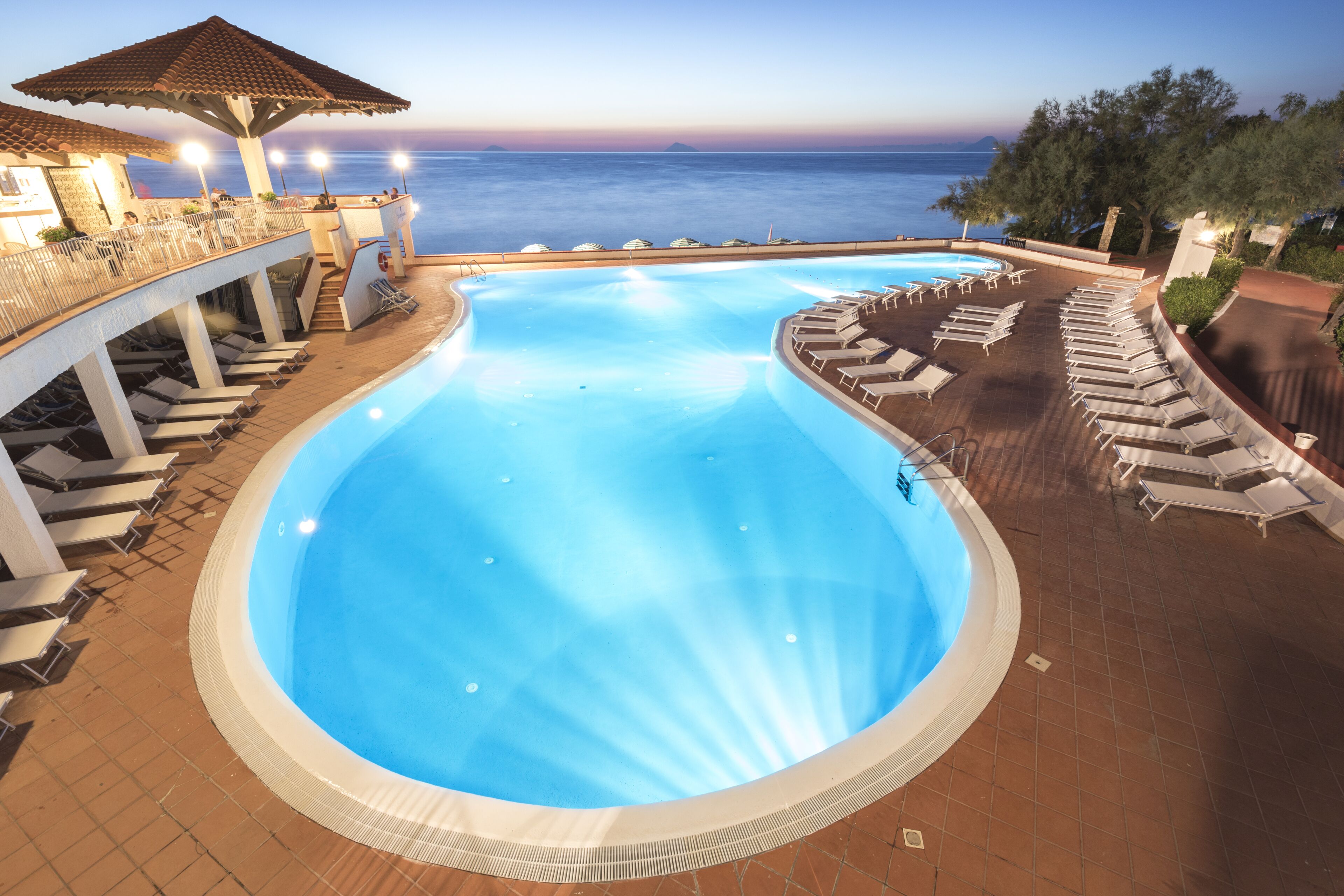 Seasonal outdoor pool, pool umbrellas, pool loungers