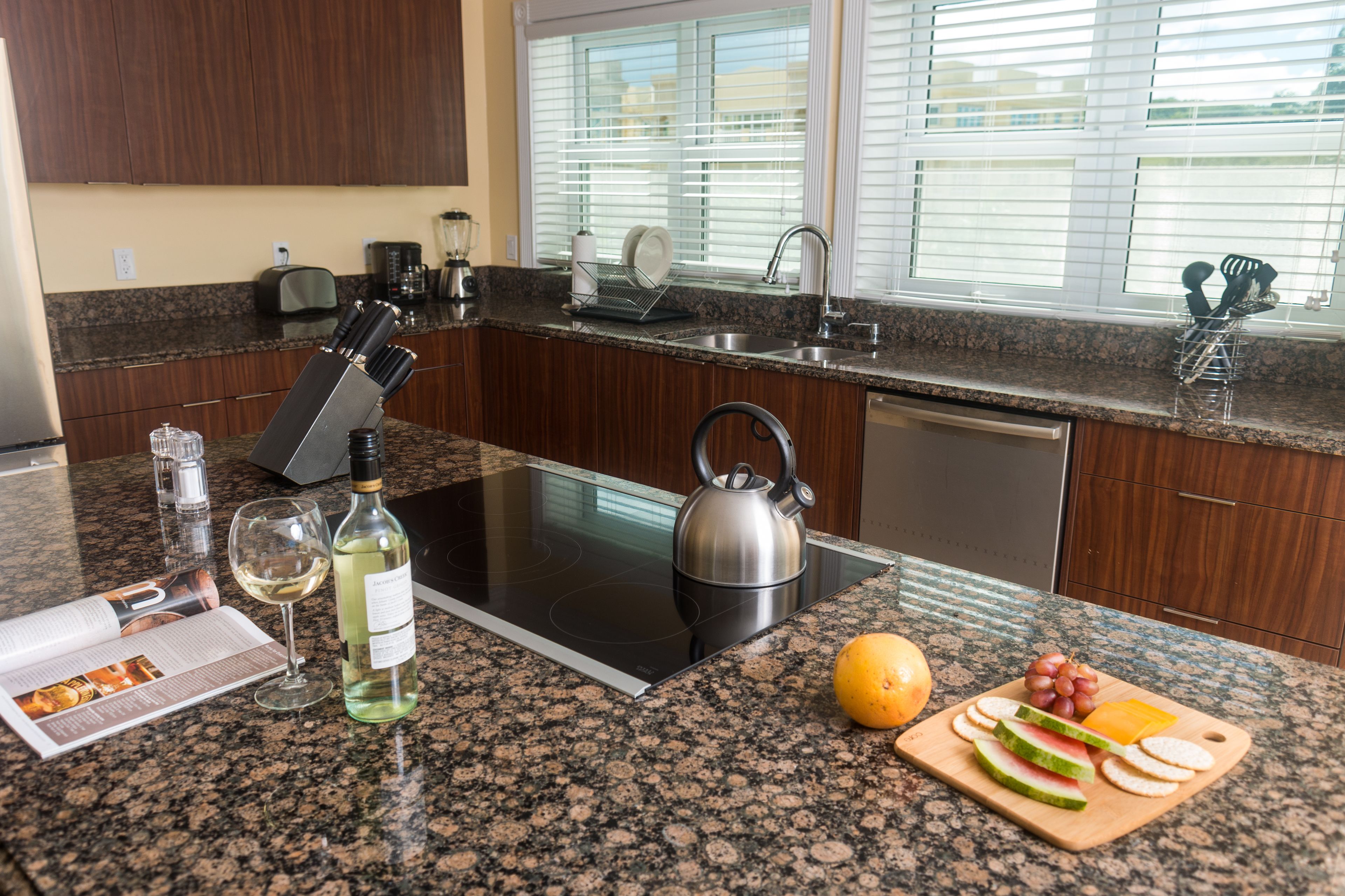 full-sized fridge, microwave, stovetop, dishwasher