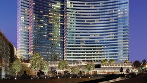 A modern high-rise building with the name 'Vdara' prominently displayed.