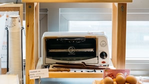 A breakfast display with bread, a toaster, and various breakfast items.