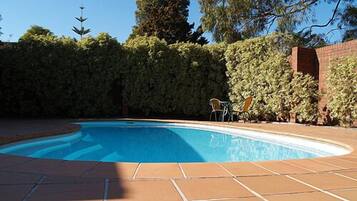Seasonal outdoor pool, open 7:00 AM to 9:00 PM, sun loungers