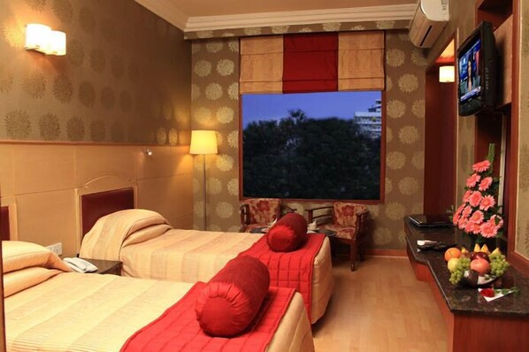 Camera Deluxe | Biancheria da letto di alta qualità, minibar, una cassaforte in camera