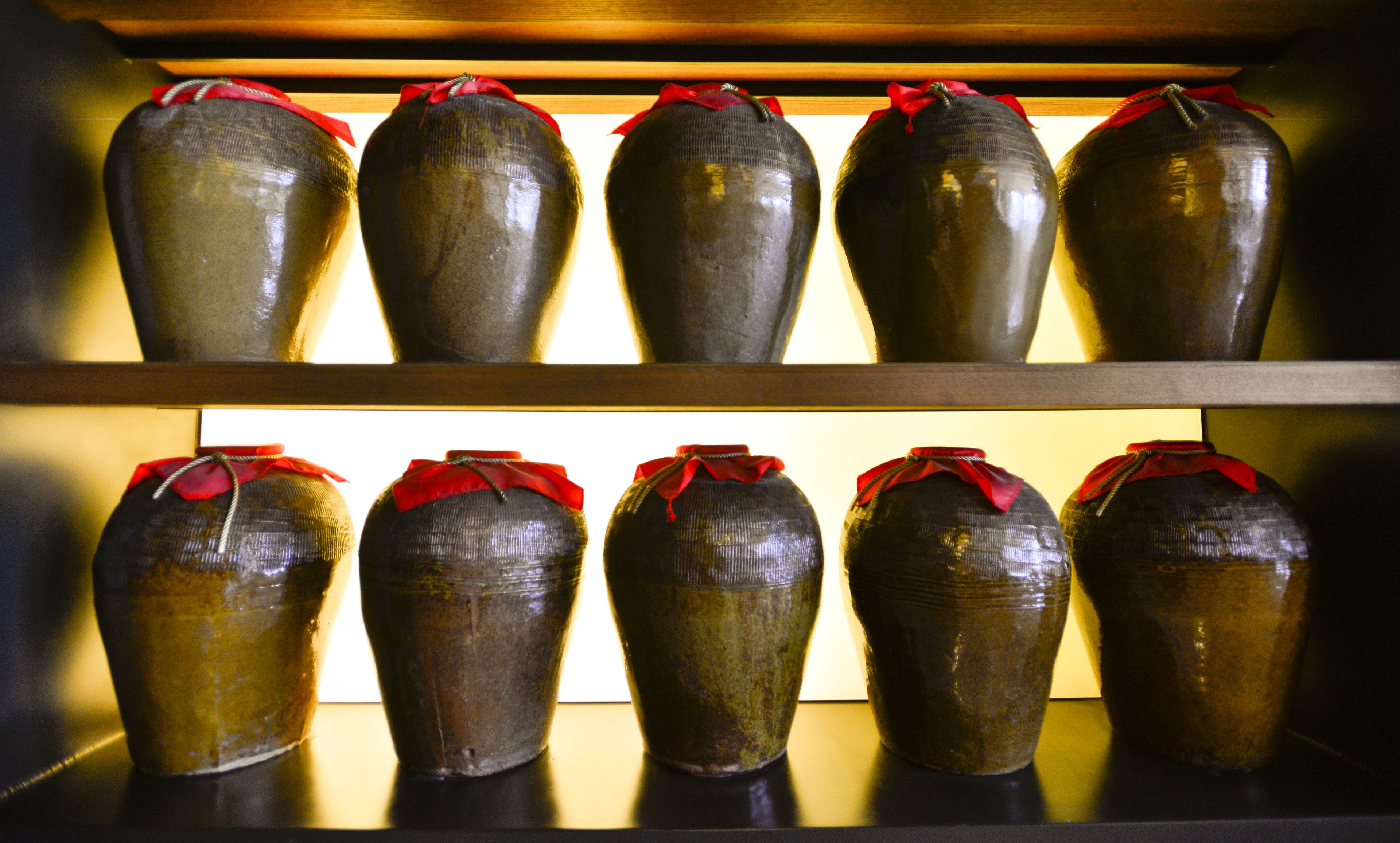 A display of vases on shelves.