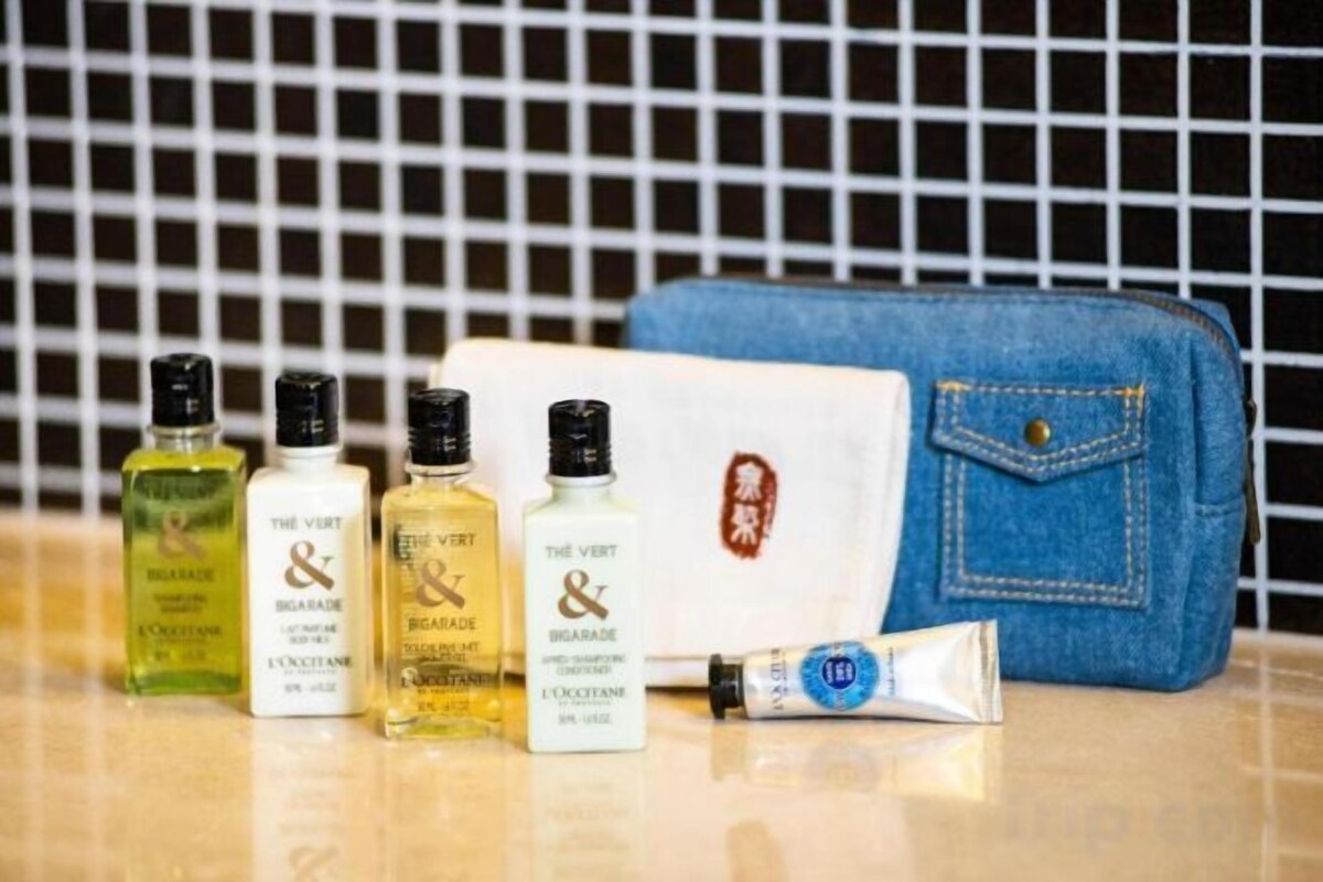 Designer toiletries, hair dryer, bathrobes, slippers