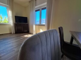 Family Apartment, 2 Bedrooms (B) | Living room | 32-inch flat-screen TV with satellite channels, TV