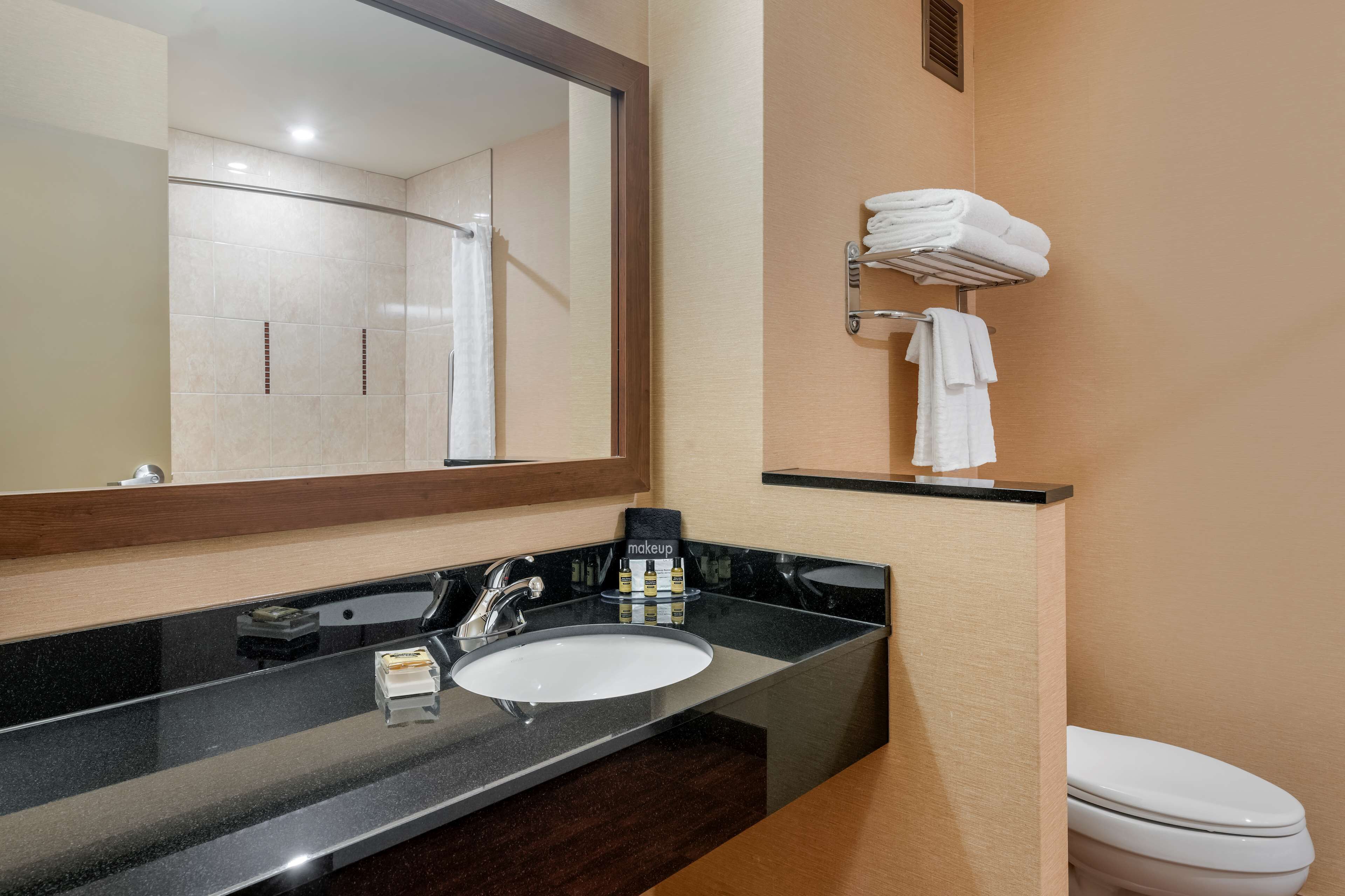standard room, 2 queen beds, non smoking, refrigerator & microwave | bathroom | combined shower/bathtub, free toiletries, hair dryer, towels