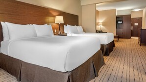 A hotel room with two beds, a wooden headboard, a desk, and a wardrobe. - Best Western Plus Bathurst Hotel & Suites (Bathurst)