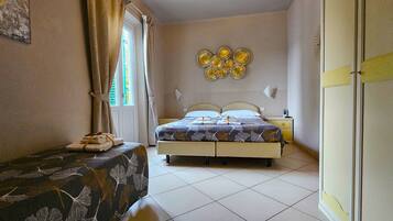 Triple Room | Premium bedding, free minibar, in-room safe, desk