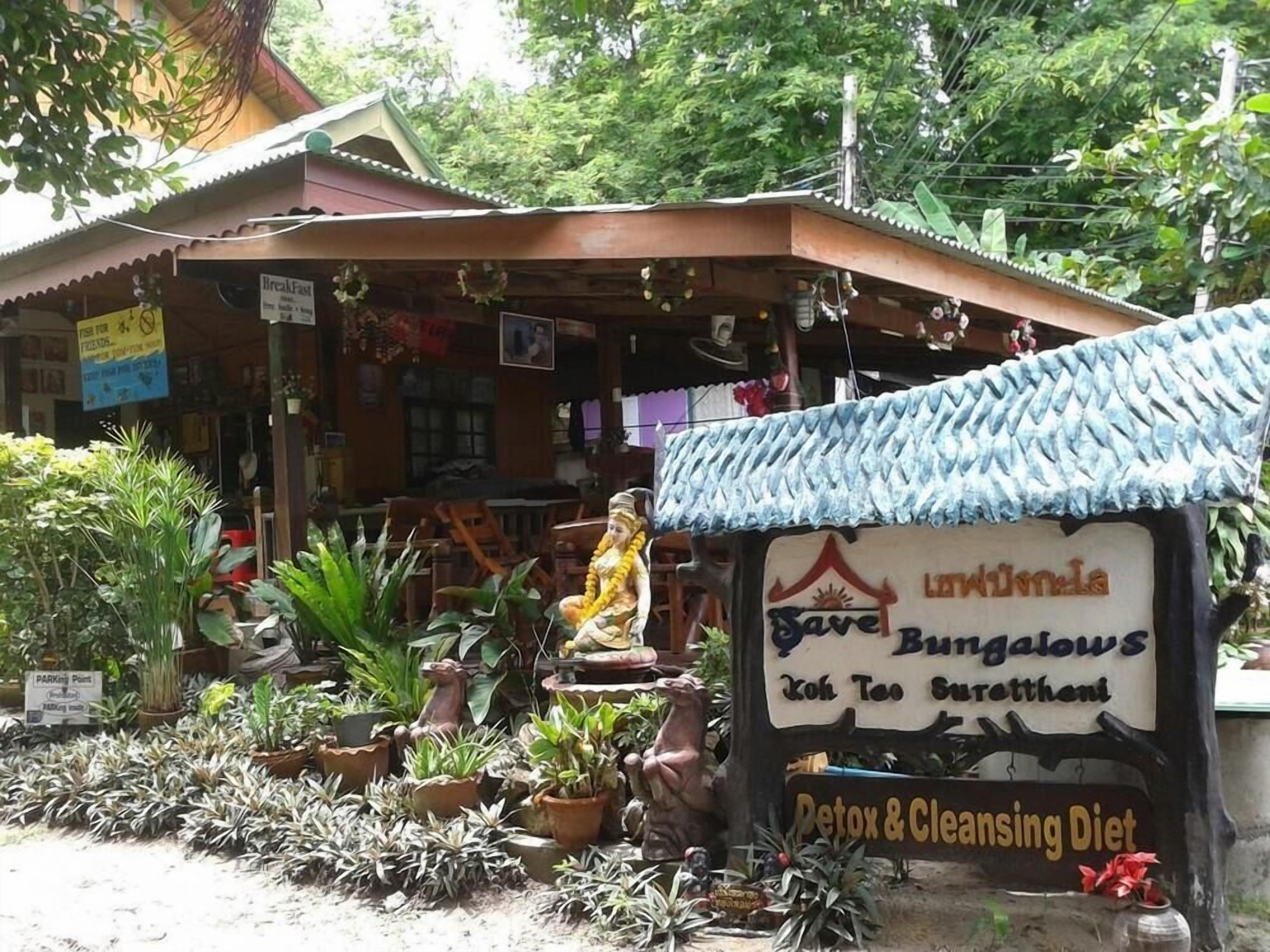 A bungalow with a sign advertising a detox and cleansing diet.