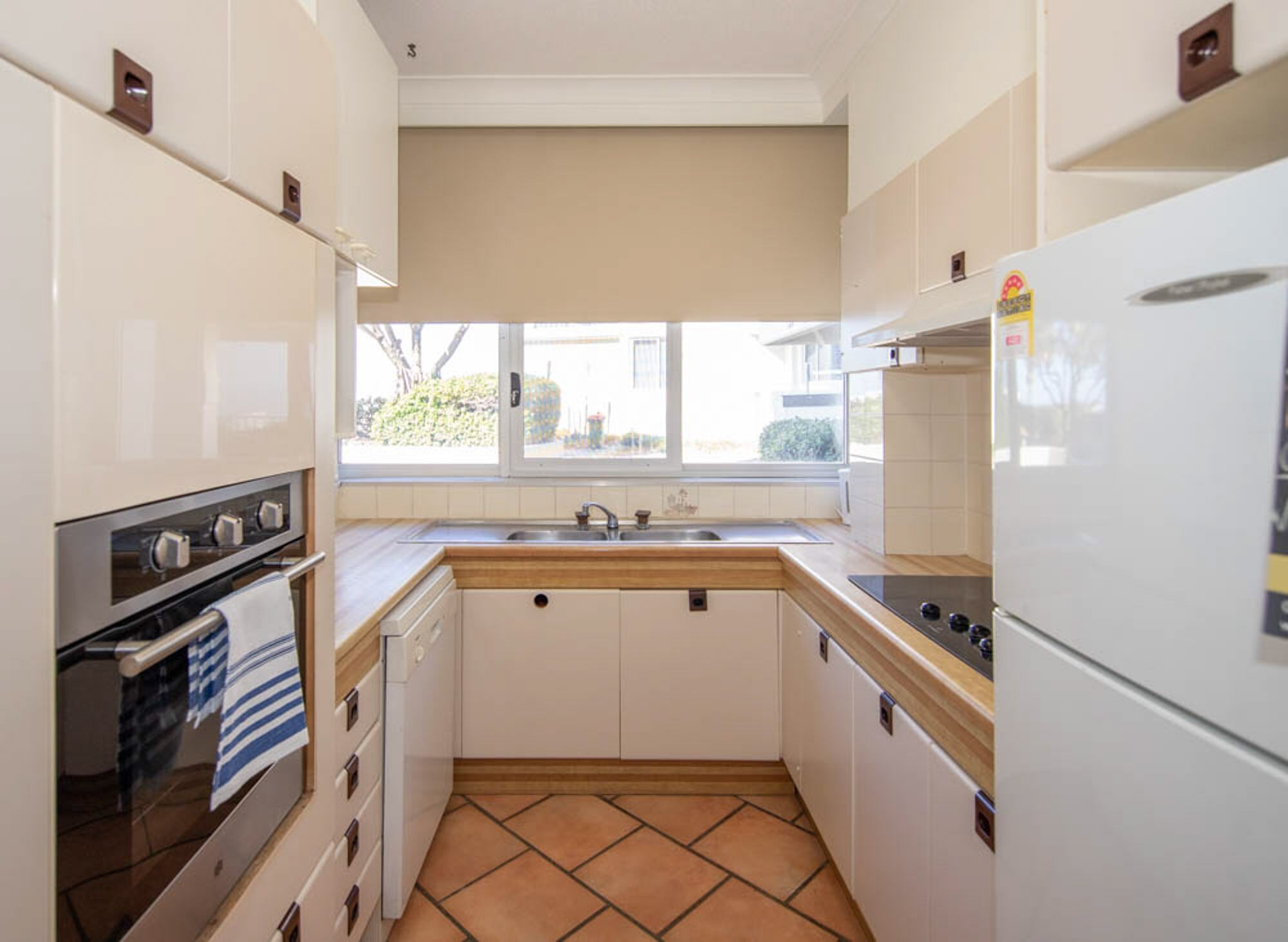 traditional apartment | private kitchen | full-sized fridge, microwave, stovetop, dishwasher