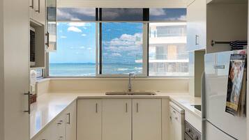 Panoramic Apartment, 3 Bedrooms | Private kitchen | Full-size fridge, microwave, stovetop, dishwasher