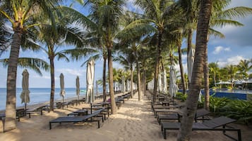 Private beach, white sand, beach umbrellas, beach towels