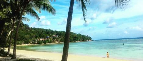 On the beach, white sand, beach towels