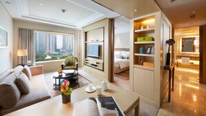 A modern hotel room with a large window, a sofa, a coffee table, a reading area, a TV, and a kitchenette. - IFC Residence (Shanghai)