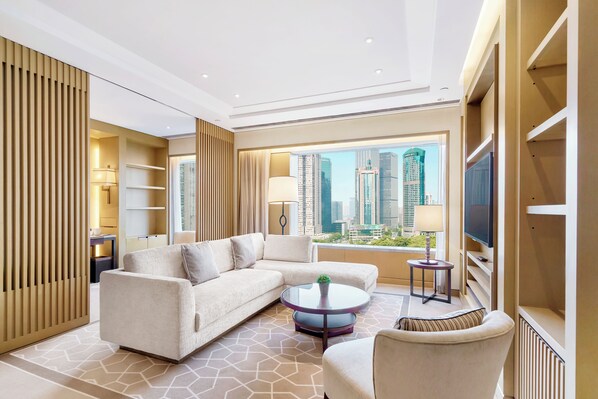 Deluxe Suite, 2 Bedrooms | Living area | Flat-screen TV, DVD player, iPod dock