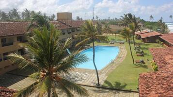 Outdoor pool, pool umbrellas, sun loungers