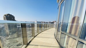 A modern building with a glass exterior and a tiled floor. - Parkside Hotel & Apartments (Baku)