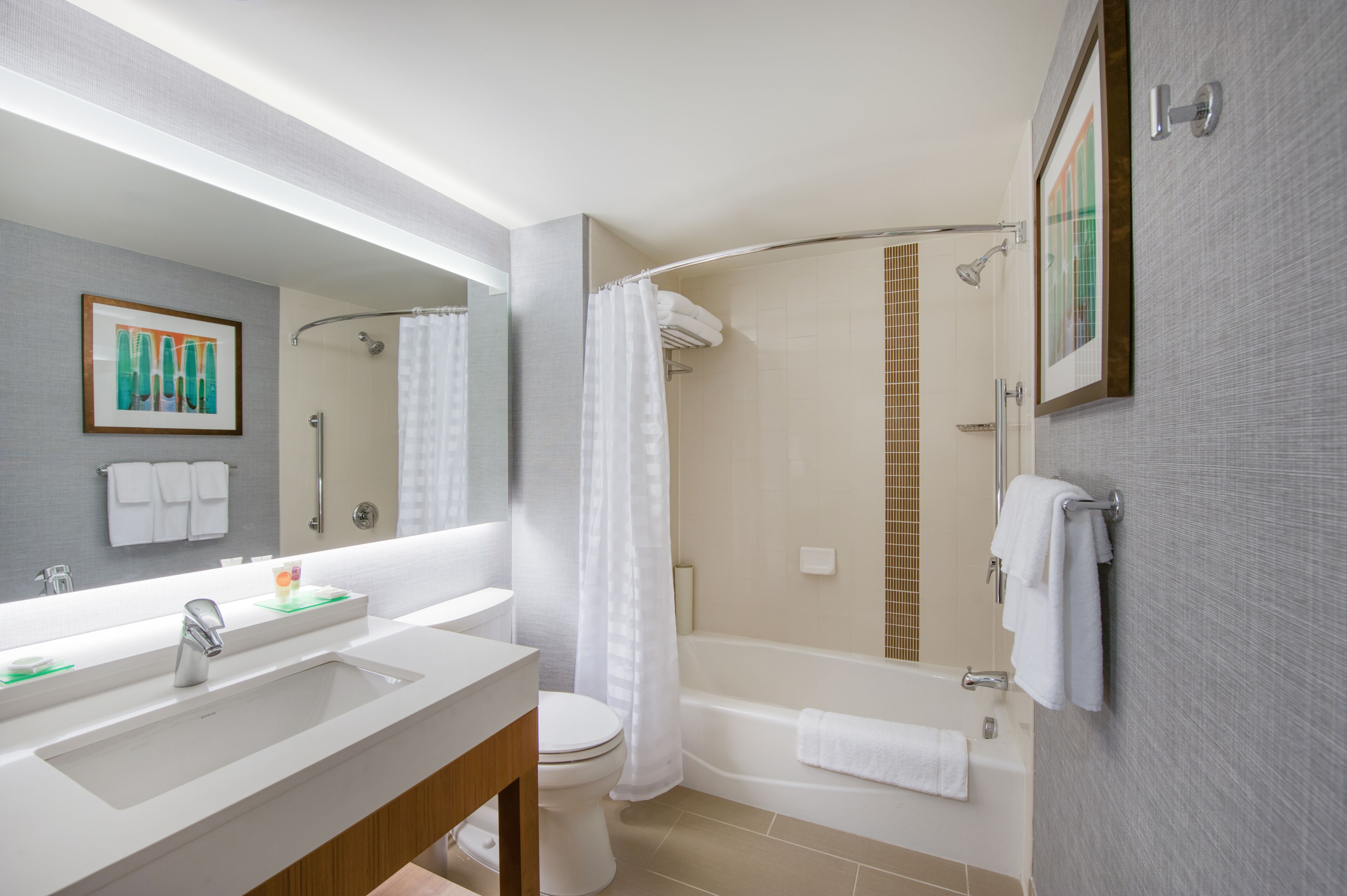 designer toiletries, hair dryer, towels