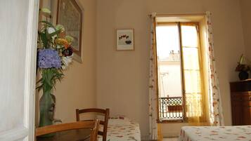 Triple Room, Private Bathroom | Individually decorated, desk, blackout curtains, iron/ironing board