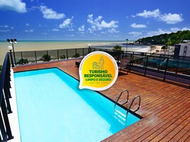 Outdoor pool, pool umbrellas, sun loungers