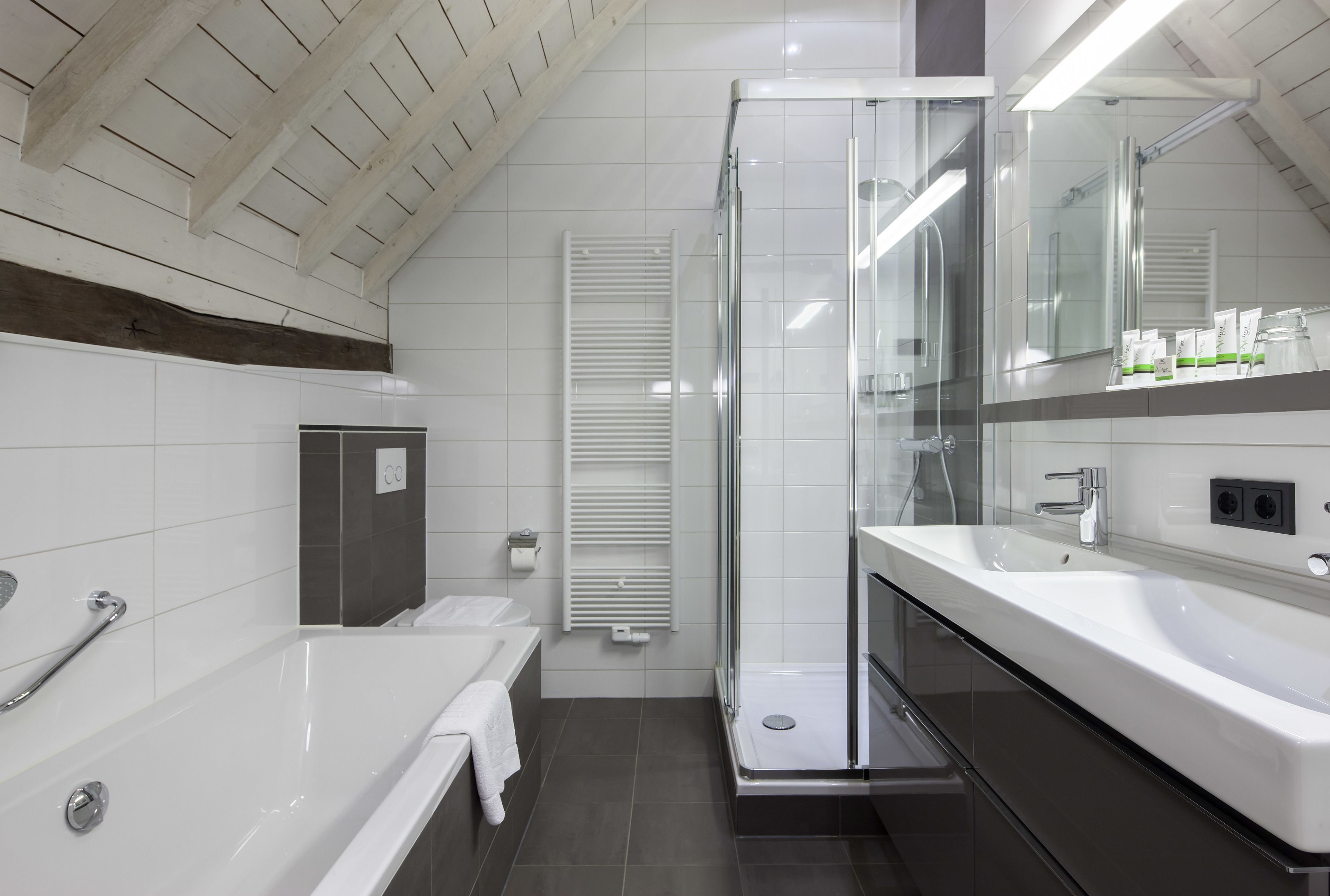 junior suite | bathroom | eco-friendly toiletries, hair dryer, towels