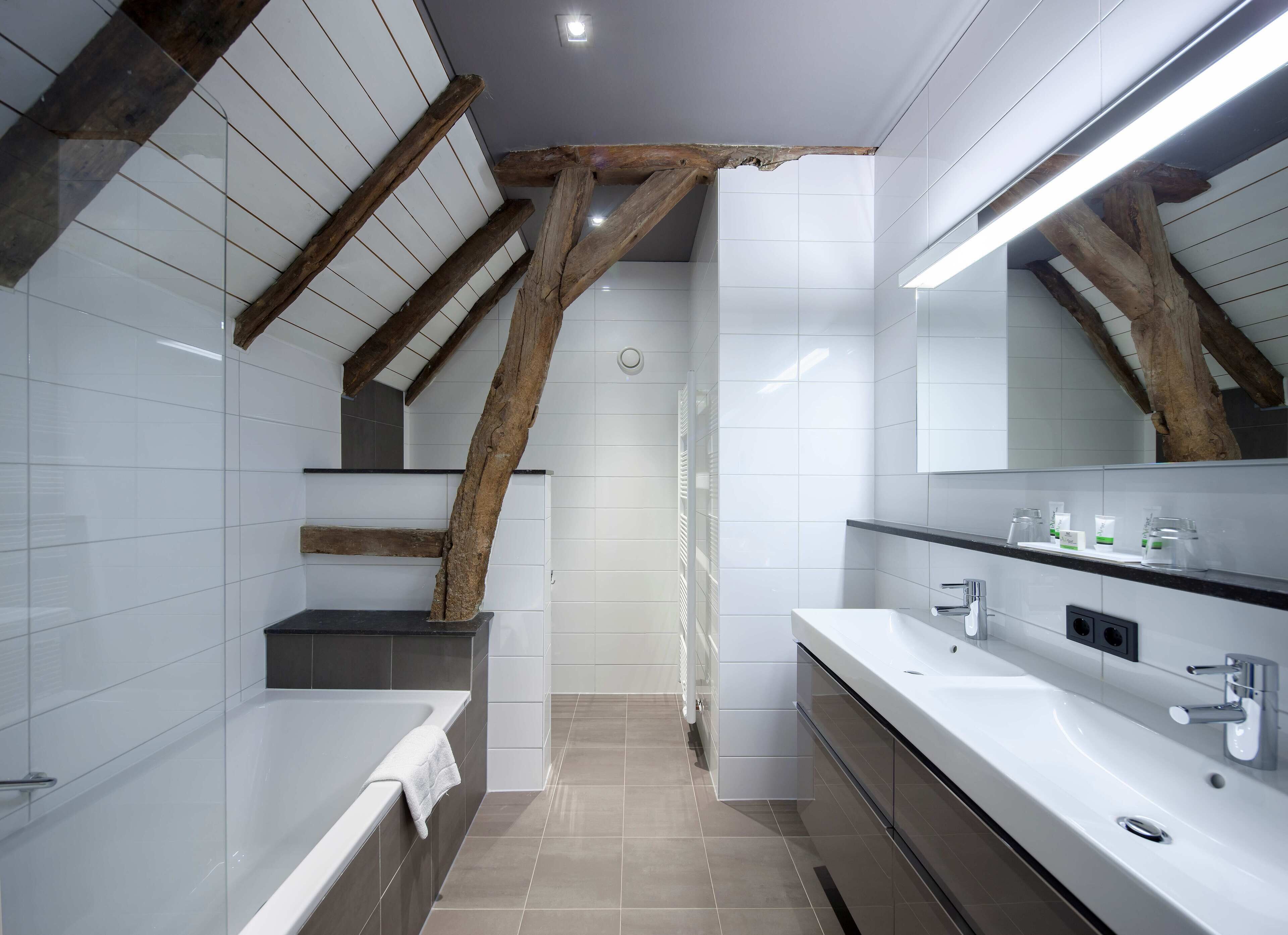 signature suite | bathroom | eco-friendly toiletries, hair dryer, towels