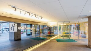 A modern building entrance with glass doors, a sign reading "ANA Holiday Inn," and a tiled floor. - Holiday Inn Ana Sapporo Susukino by IHG (Sapporo)