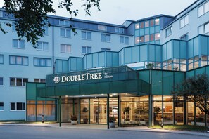 A hotel entrance with a sign reading 'DOUBLETREE by Hilton'. - DoubleTree by Hilton Vienna Bosei (Vienna)