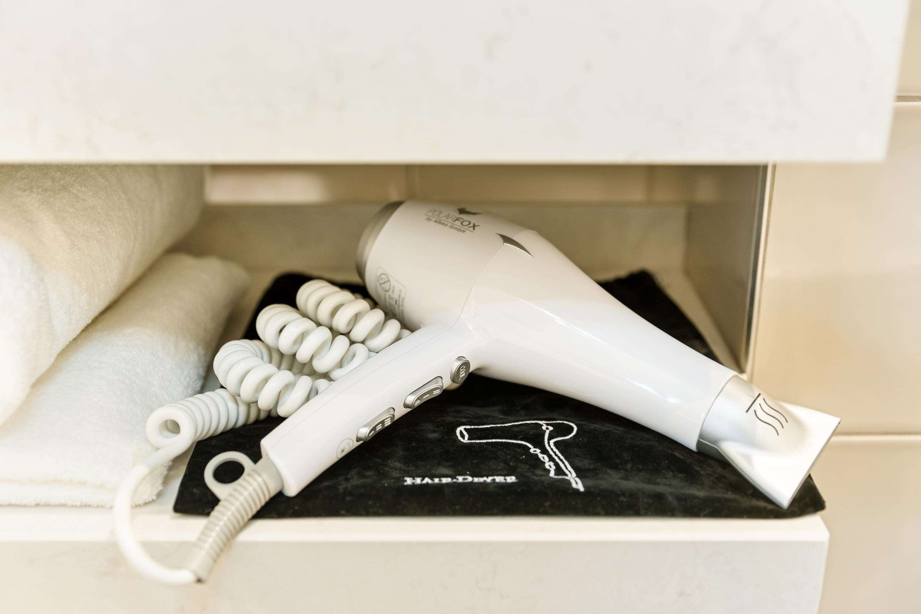 hair dryer, towels, soap, shampoo