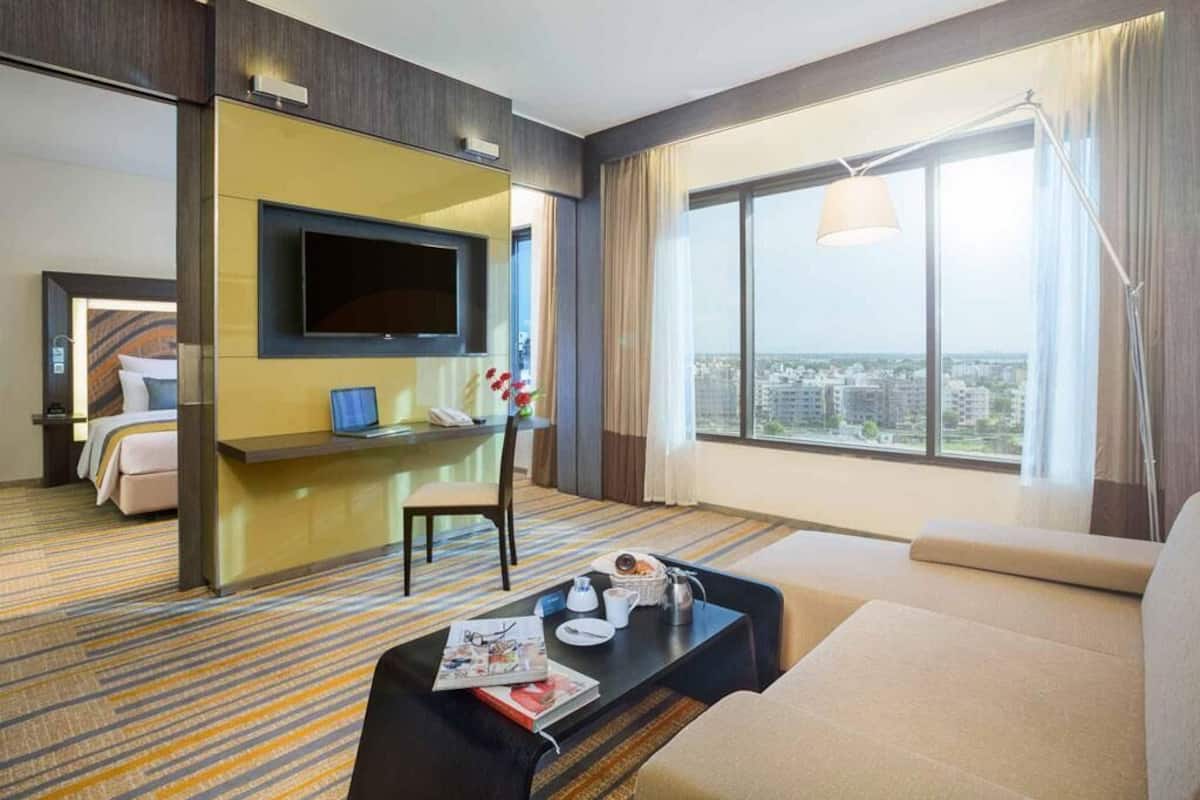 Premier Suite, 1 King Bed, Club Lounge Access | Premium bedding, down comforters, minibar, in-room safe