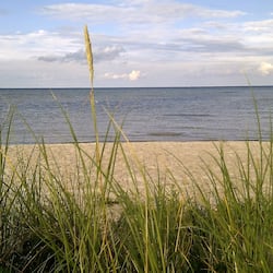 On the beach, white sand, beach towels