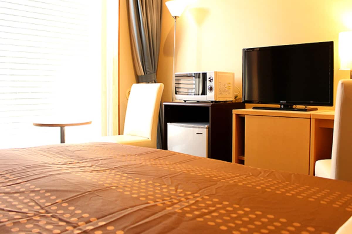Desk, laptop workspace, free WiFi, bed sheets