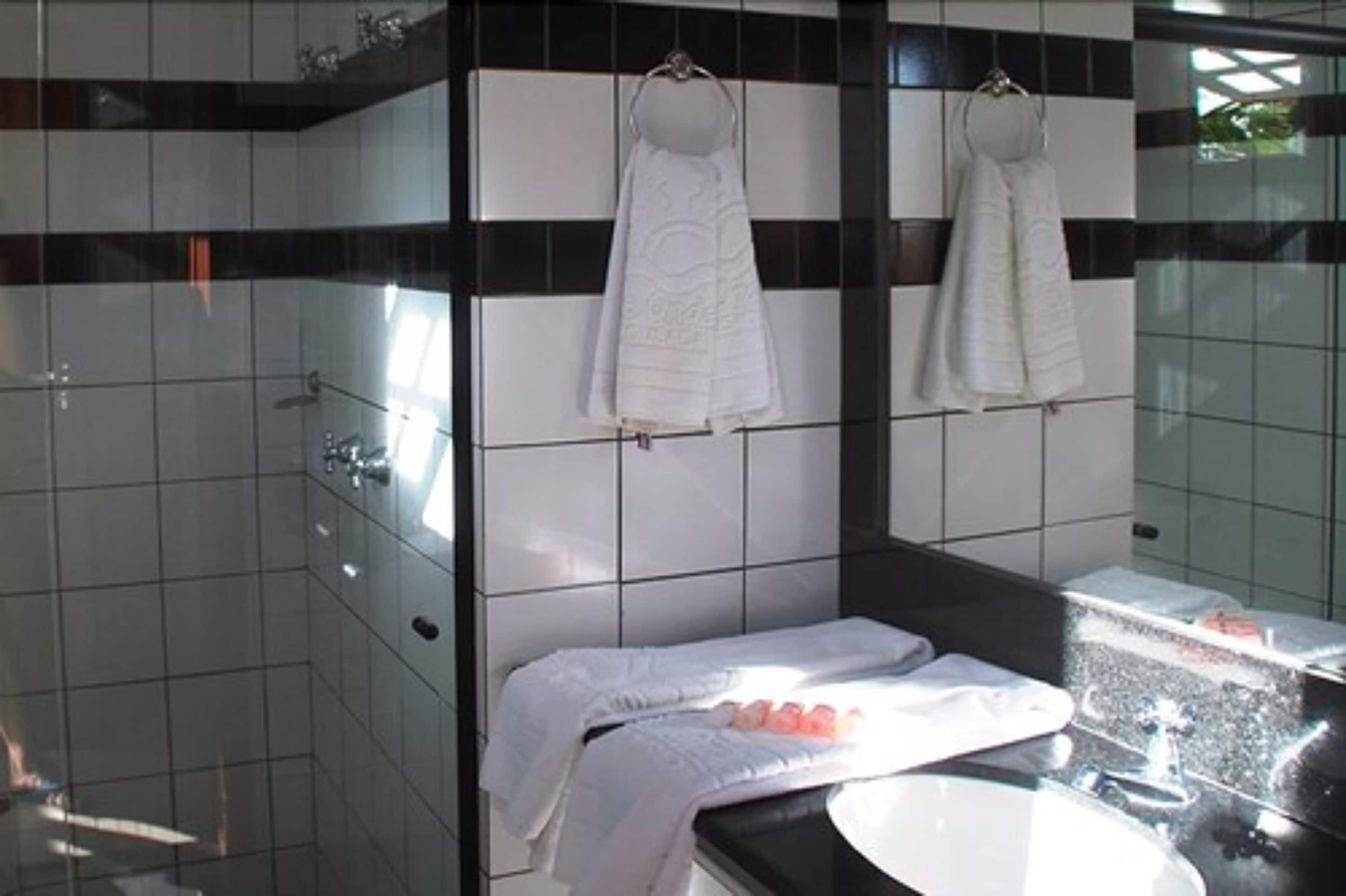 superior suite, pool view | bathroom | shower, free toiletries, towels