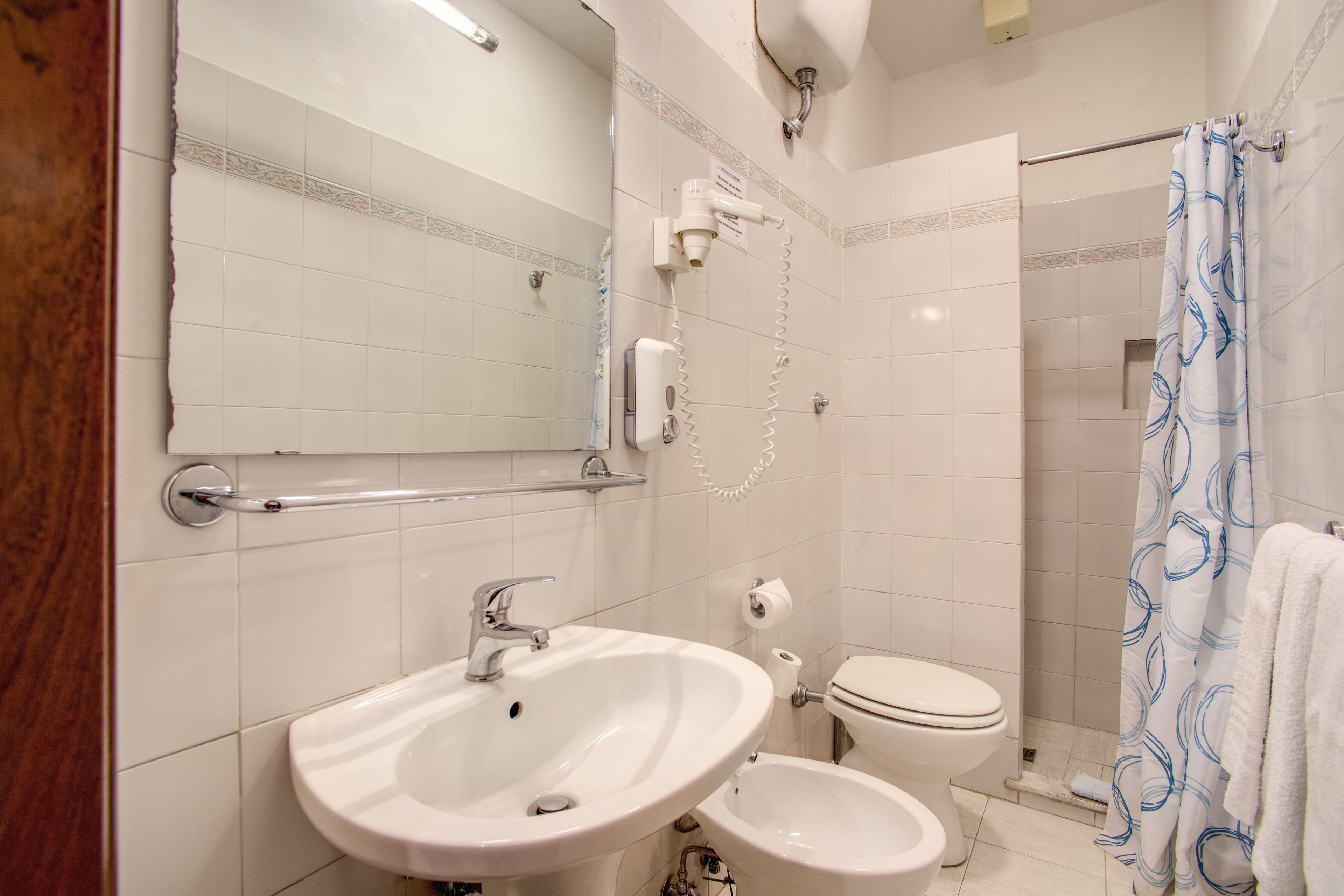 standard triple room | bathroom | shower, hair dryer, towels, soap